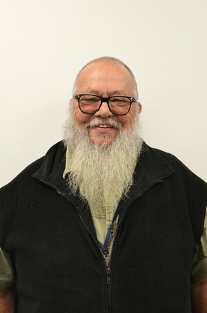 a photo of David, a man, happy, wearing glasses, no hair, long white beard